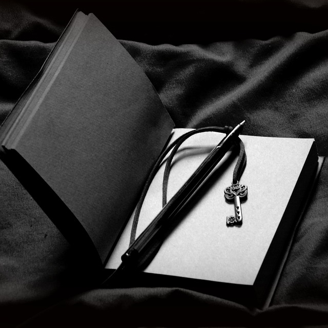 open journal with pen and reflection prompts